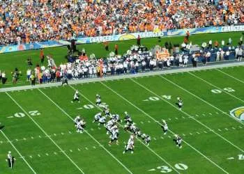 football players on green field during daytime